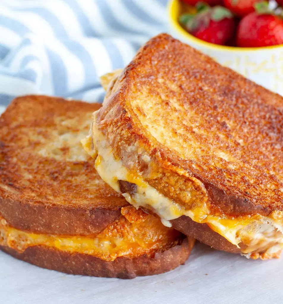 2 grilled cheese sandwiches on a plate in 2021