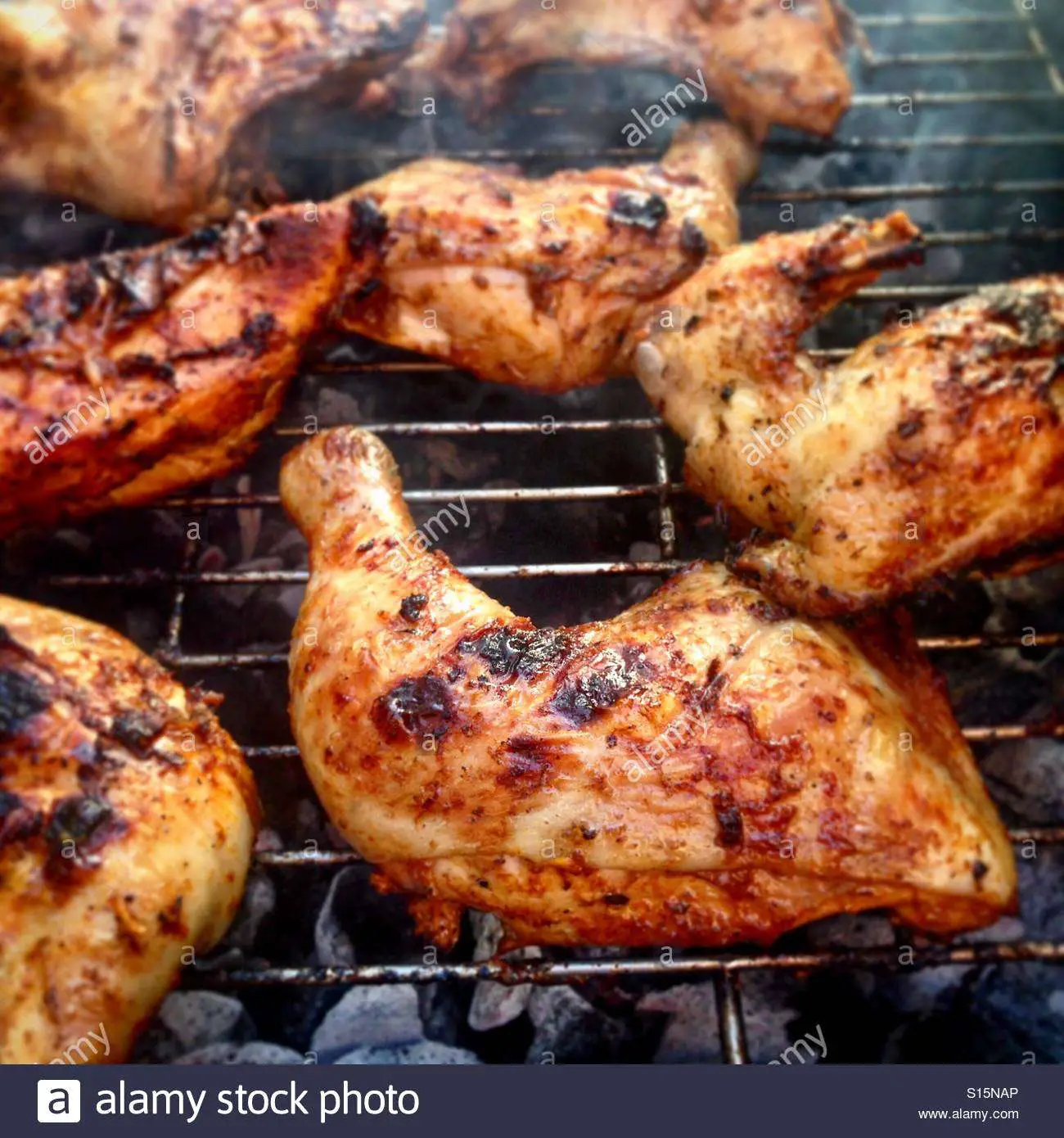 Closeup of making BBQ chicken on a charcoal grill Stock ...