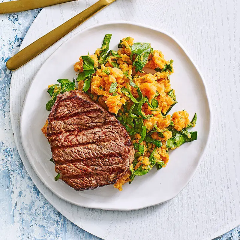 Grilled steak with sweet potato and spinach mash
