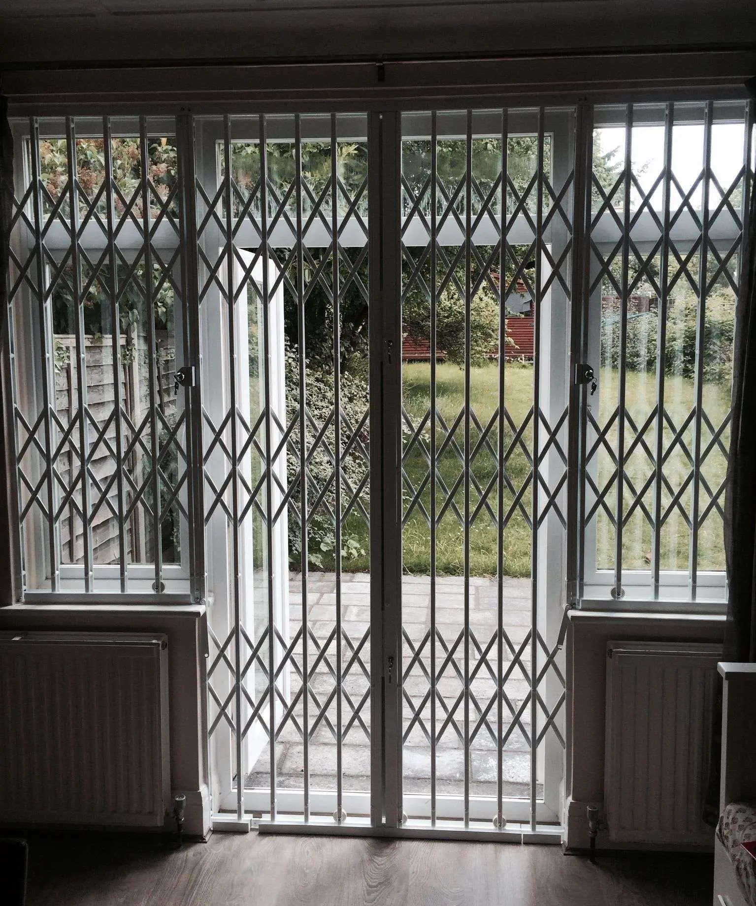 Our RSG1000 retractable security grilles fitted to a patio door with ...